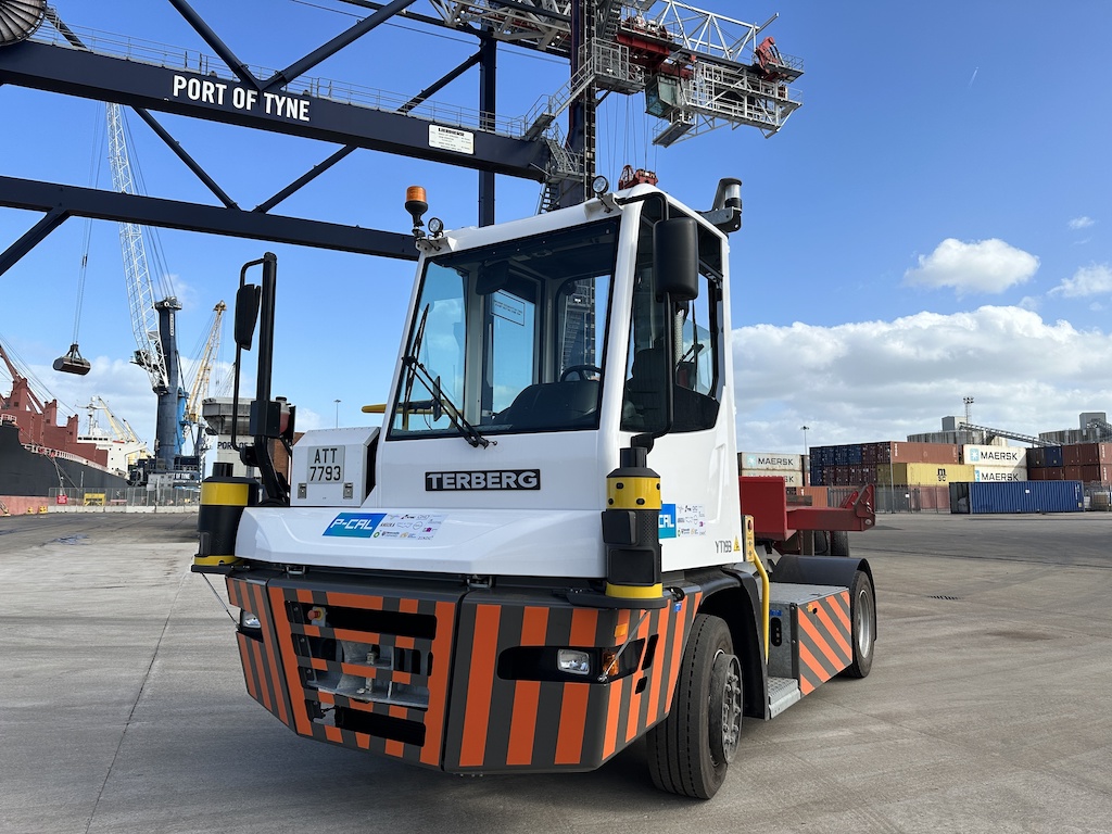 An autonomous terminal tractor driven by Oxaas self driving technology shown quayside at Port of Tyne